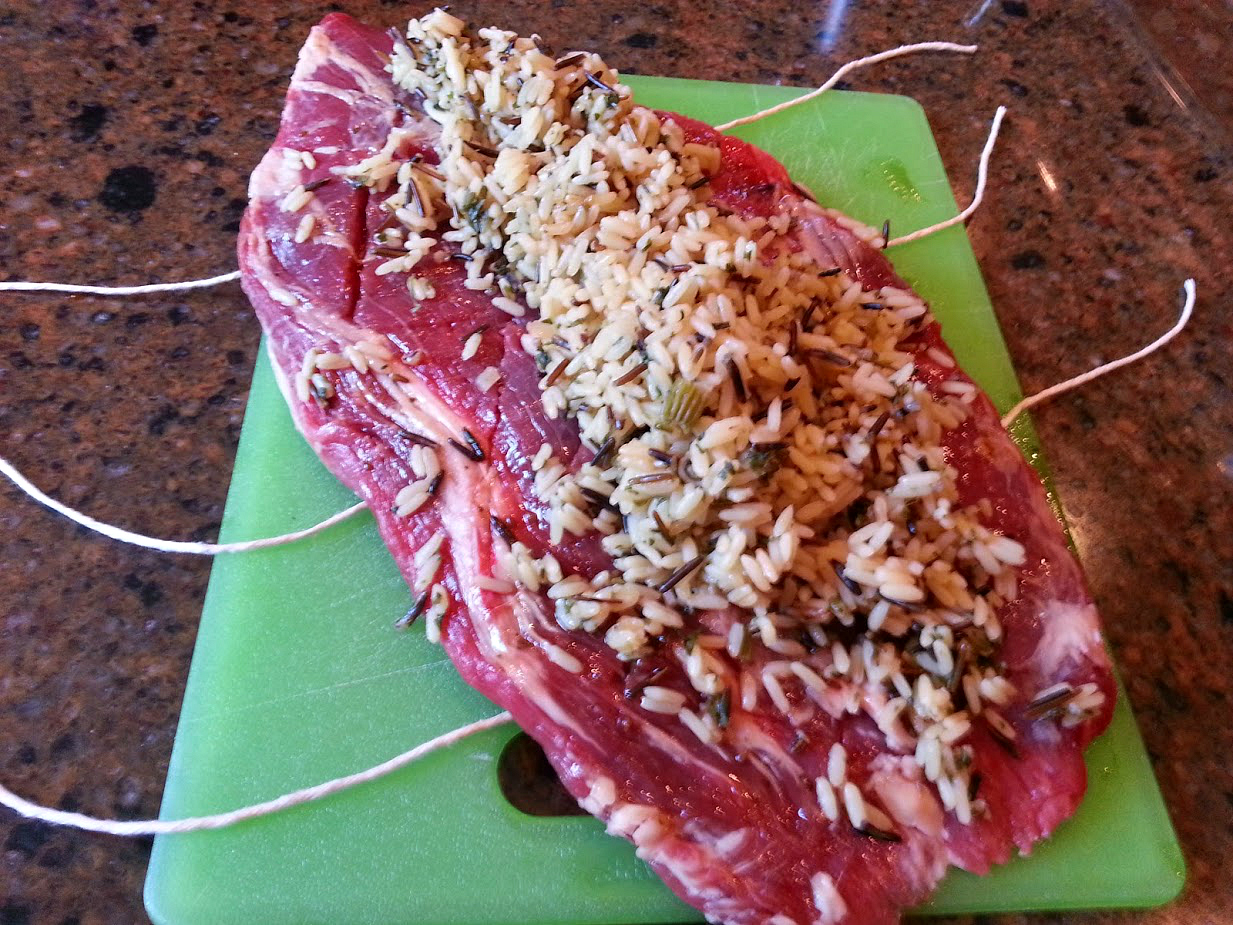 Rice stuffed flank steak recipe prep- tying the meat